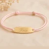 Bracelet baptême fille cordon rose personnalisé avec prénom